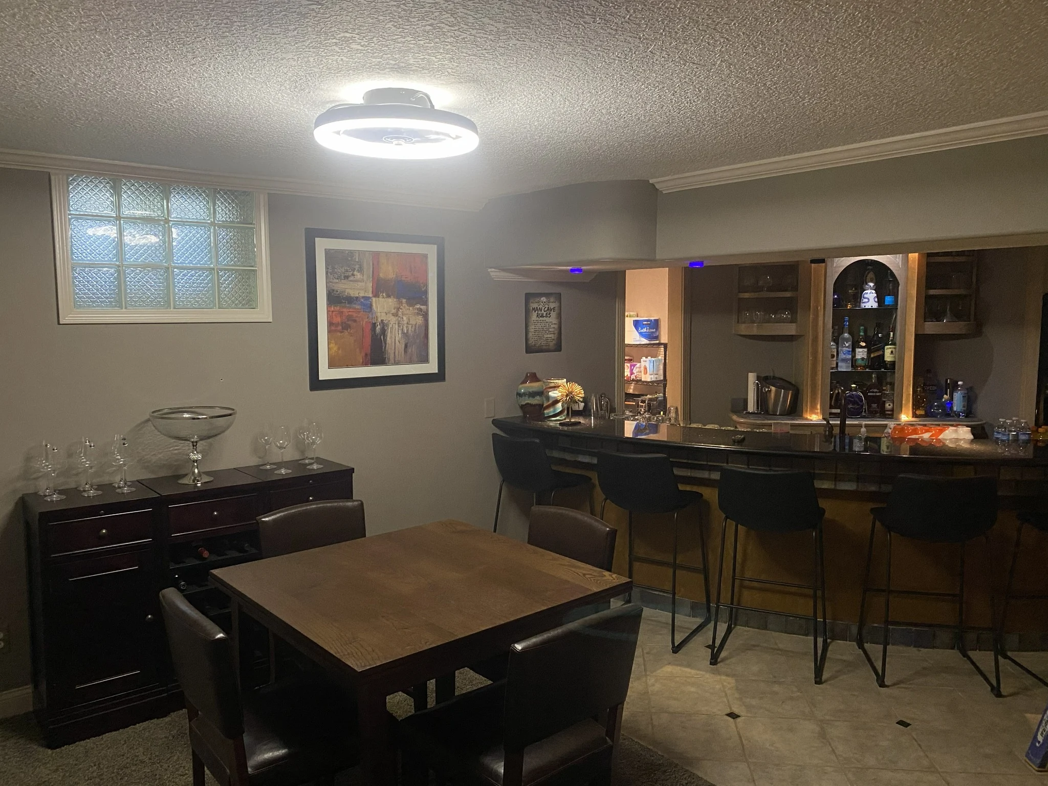 Interior entertaining space with installed ceiling lighting