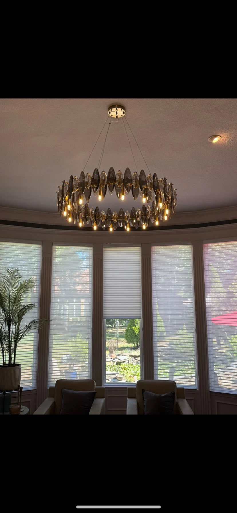 Decorative chandelier illuminating a residential interior